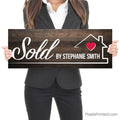 real estate agent closing day sold by photo sign