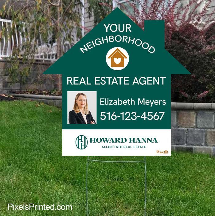 A real estate agent's house-shaped yard sign positioned near a sidewalk for maximum visibility.
