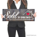 sold by realtor closing day photo sign with homeowners
