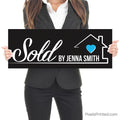 sold by realtor closing photo sign with homeowners